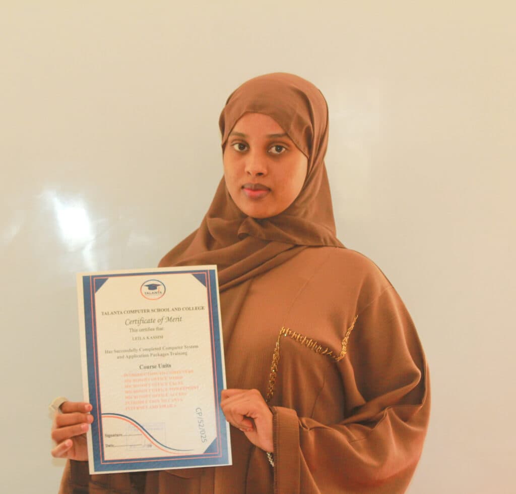 A Talanta graduate holding a computer packages training certificate