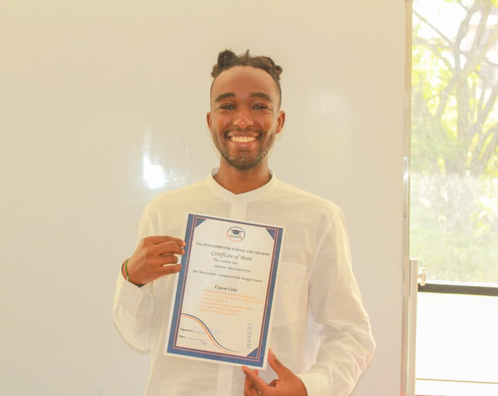 A Talanta graduate holding a web design course certificate