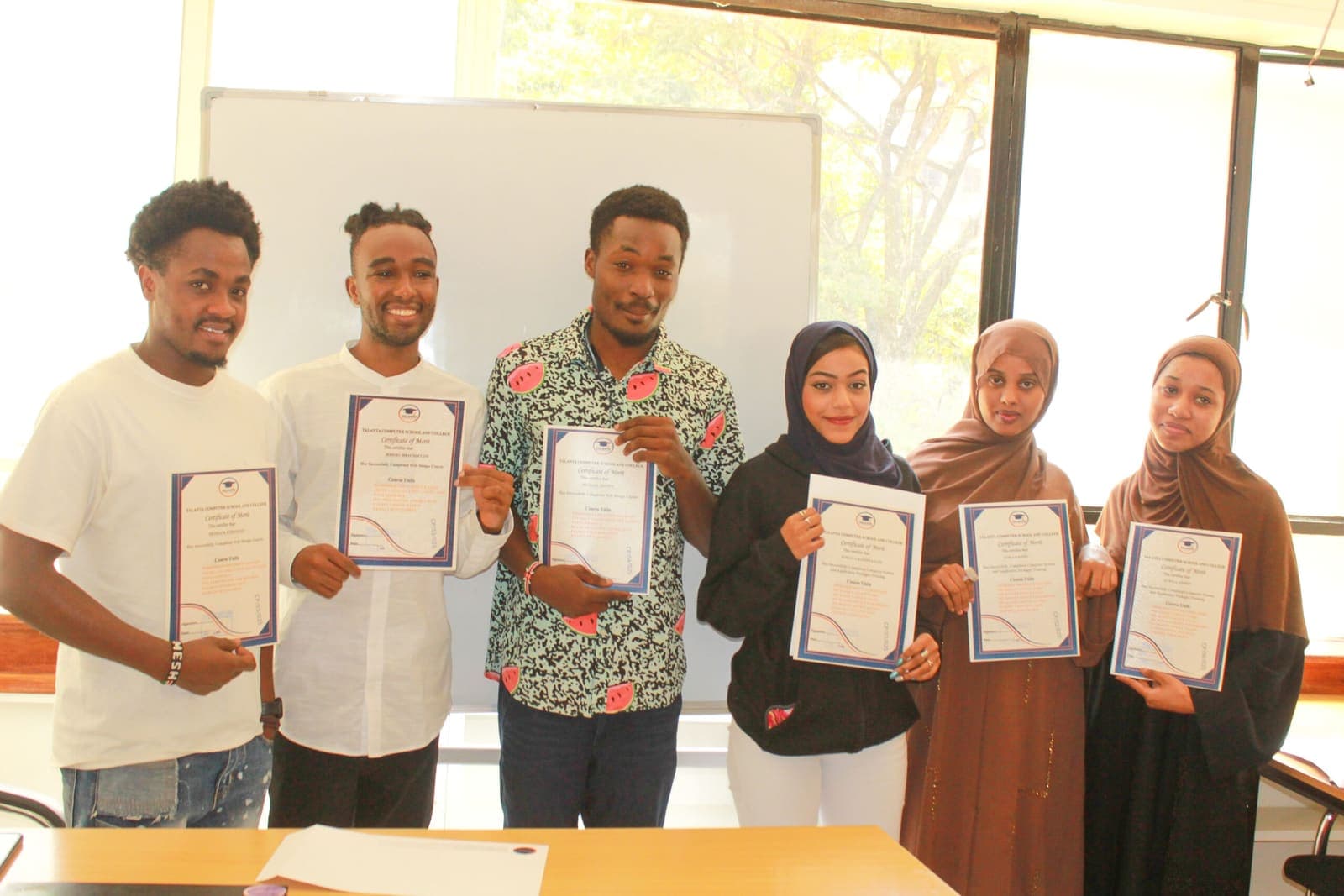 Talanta graduates holding certificates of merit