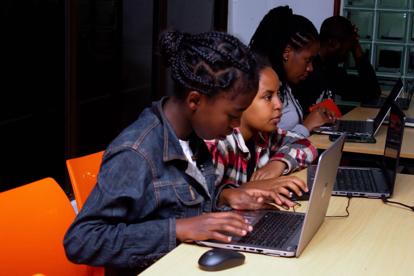Students working on laptops during a class at Talanta College of Technology